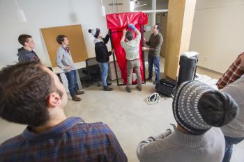 Students learn correct techniques for blower door tests