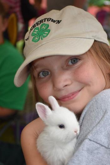 child holding a rabbit
