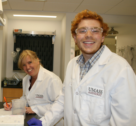 Professor Madelaine Bartlett and senior Jeffrey Heitmar in laboratory