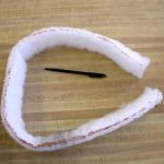 Fig_22.jpg: This fiber band was part of a sticky band that was placed around a tree trunk for 24 hours during the adult winter moth activity period. Note the orange color around the bottom edge of the band and compare to Fig_21.  (Photo: R. Childs)  