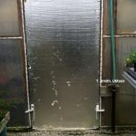 Greenhouse door insulated from inside
