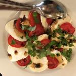 Figure 2. Tomatoes, buffalo mozzarella with balsamic vinaigrette and greens at a restaurant in Padova Italy in 2017. (Photo by Frank Mangan)