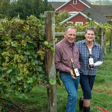 Joyce and Phil Wiley with their wine at UMass Cold Spring Orchards