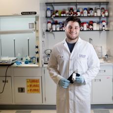 Adam Salhaney ('19) worked on project for rapid bacteria detection in food science laboratory. Photo: John Solem