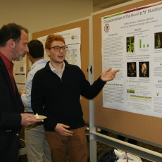 Co-Coordinator Bill Miller attends poster session with presenter Jeff Heithmar