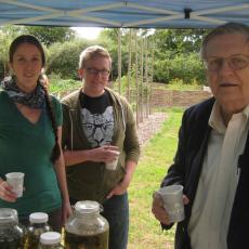 Jennie Bergeron, Aaron Drysdale and Director Arthur Kinney enjoy herb tea from the garden