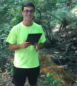 Dominic Savoy conducts research at urban watershed, Springfield, MA
