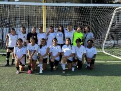 A team of girls from the UDC 4-H Youth Soccer Summer Program