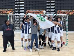 A team of boys from the UDC Winter Soccer program celebrating a win 