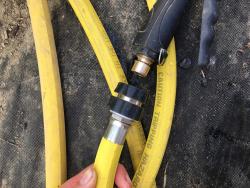 A quick connect connection between an irrigation wand and a hose