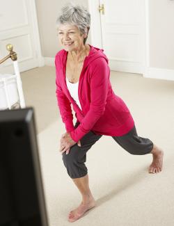 older woman doing lunges 