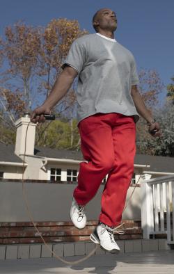 man jumping rope outside