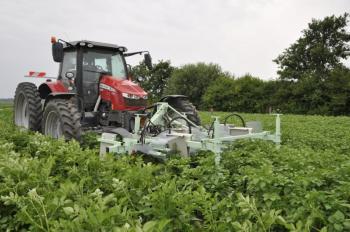 A tractor with a bug picking implement.