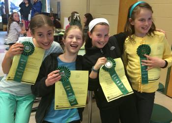 4-H members with ribbons