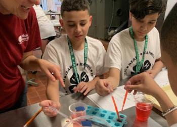 4H Youth experimenting in food science lab learning how to make gummy worms from scratch.