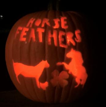 Horse Feathers Club won first prize for best spirit with 2 horses, a chicken, 4-H clover and their club name carved into their pumpkin!