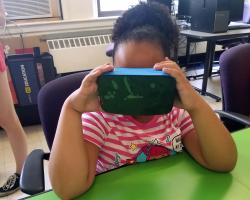 girl using virtual reality goggles