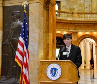 Trevor speaking at the State House