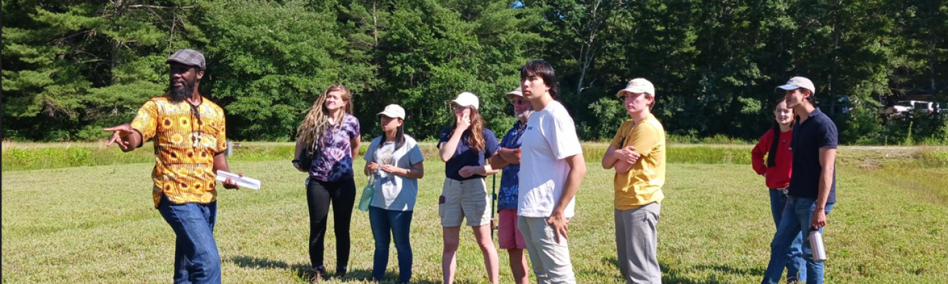REEU Interns listen to a researcher at the UMass Cranberry Research Station describe his latest project.