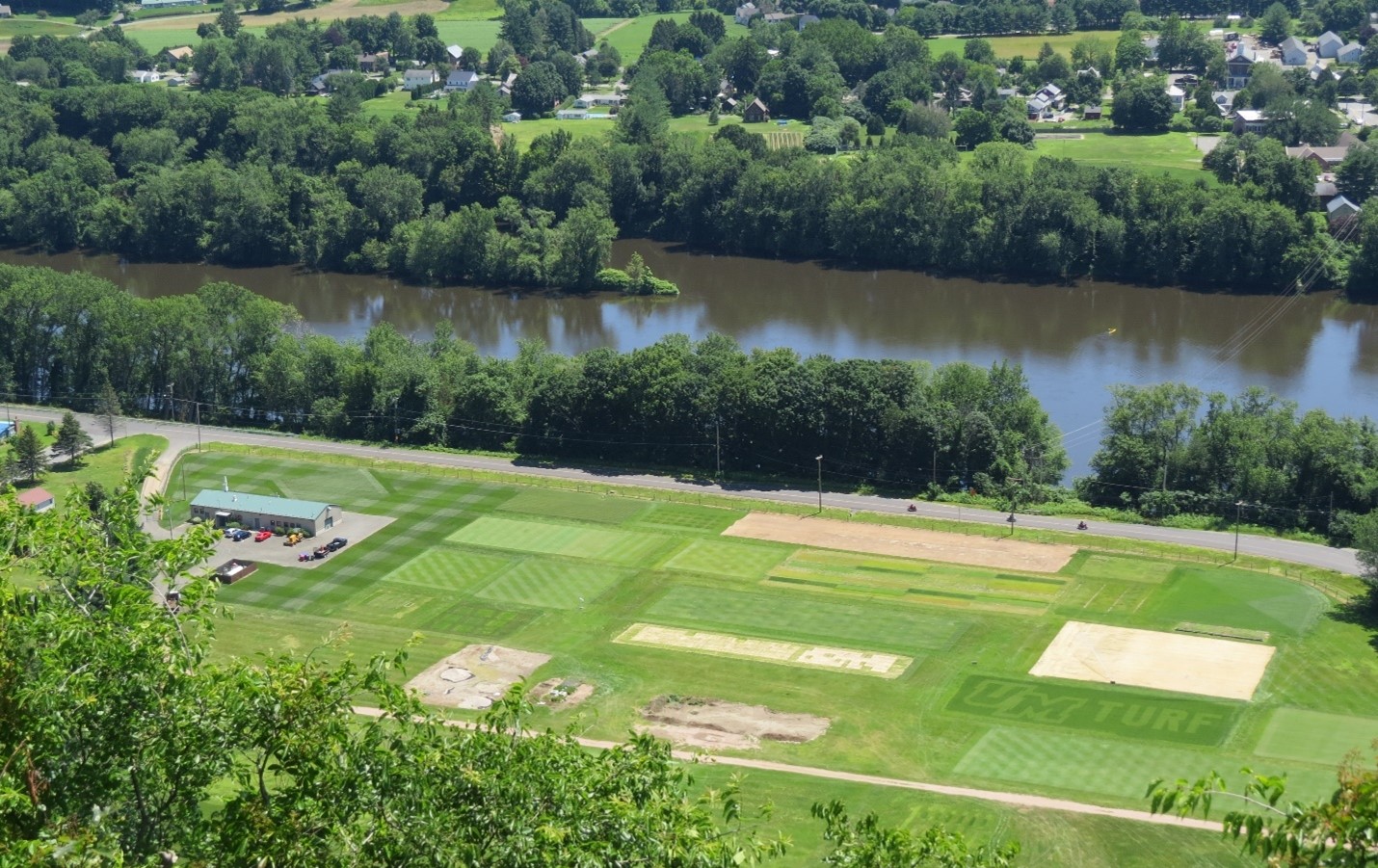 Joseph Troll Turfgrass Research and Education Center dedicated in 2004 is bordered by the Connecticut River in South Deerfield, Massachusetts (photo from 2019).
